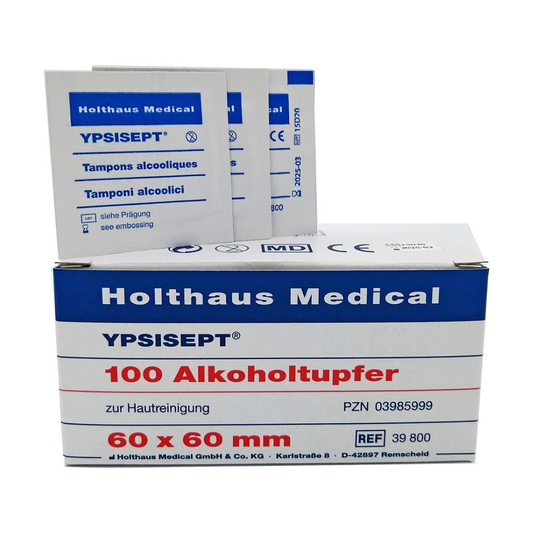 Schachteln mit Holthaus Medical Holthaus Ypsisept® Alkoholtupfer, gestapelt mit sichtbaren Etiketten, die Produktinformationen liefern, überwiegend in weiß-blauer Verpackung.