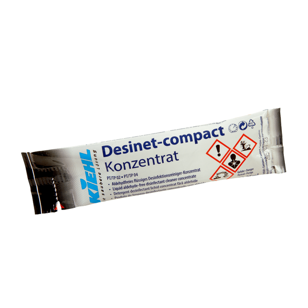 Eine silber-blaue Einwegpackung der Johannes Kiehl KG mit der Aufschrift "Kiehl Desinet-compact Konzentrat" enthält ein aldehydfreies flüssiges Desinfektionsmittel-Reinigungskonzentrat mit deutschem Text und Gefahrstoffhinweisen.