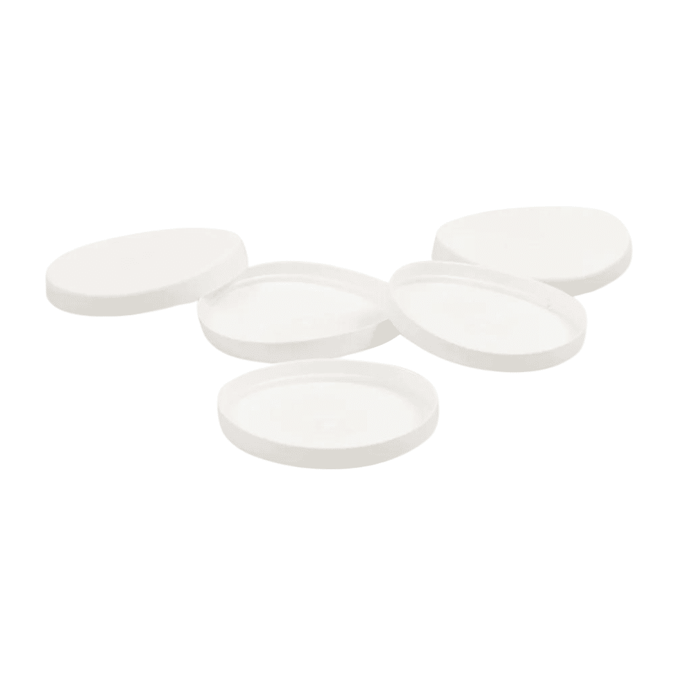 Five translucent, oval, white tablets are arranged on a solid white background next to a discontinued item from Meditrade GmbH: lids for single-use medical cups 30ml (pack, 750 pieces).