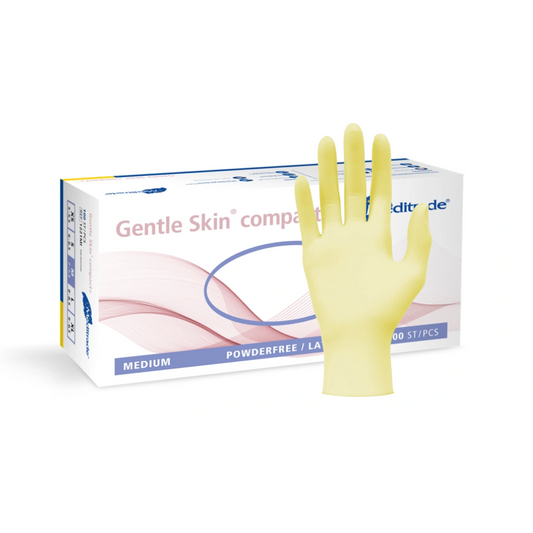 Ausgestellt ist eine Schachtel mittelgroßer, puderfreier medizinischer Handschuhe Meditrade Gentle Skin® Latexhandschuhe compact+ Einweghandschuh, davor ausgestreckt ein gelber Latex-Einweghandschuh.