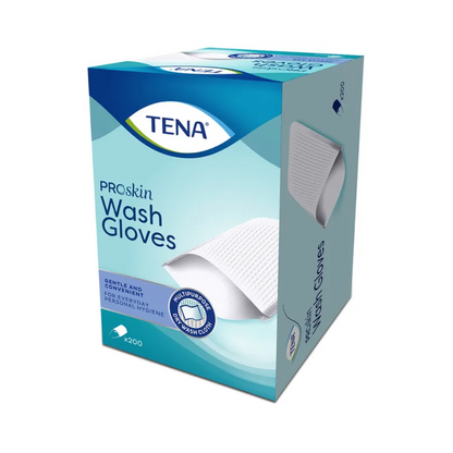 Bild einer Schachtel TENA Wash Gloves Waschhandschuhe von TENA - Essity Germany GmbH. Die Verpackung ist überwiegend hellblau und zeigt das Bild eines Handschuhs, was die „SANFTE UND PRAKTISCHE“ Verwendung zur Körperreinigung betont. Sie enthält „ALOE VERA & KAMILLE“ und ist ein latexfreies Produkt mit 200 Handschuhen für die tägliche Körperhygiene.
