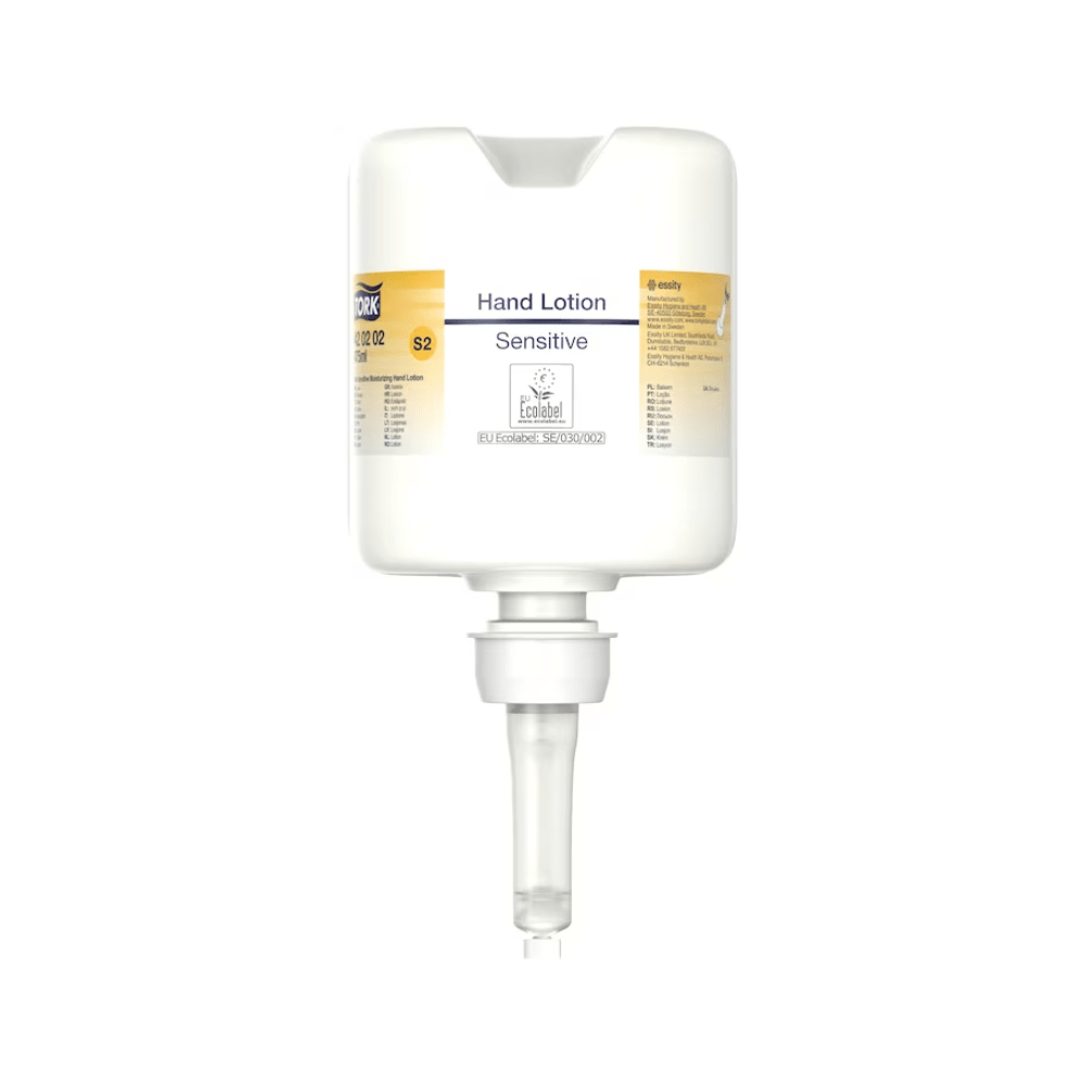 A Tork 420202 hand lotion dispenser in white with a clear nozzle and the words “Sensitive Moisturizing Hand Sanitizer” in small print features a minimalist design focused on dispensing moisturizing lotion, perfect for caring for sensitive skin.