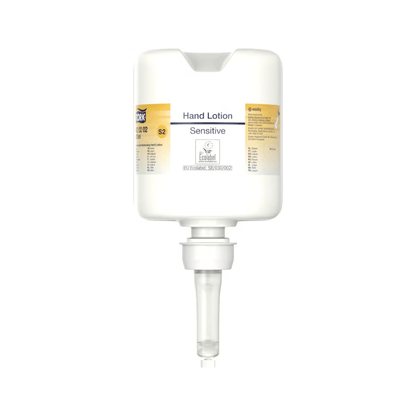 A Tork 420202 hand lotion dispenser in white with a clear nozzle and the words “Sensitive Moisturizing Hand Sanitizer” in small print features a minimalist design focused on dispensing moisturizing lotion, perfect for caring for sensitive skin.