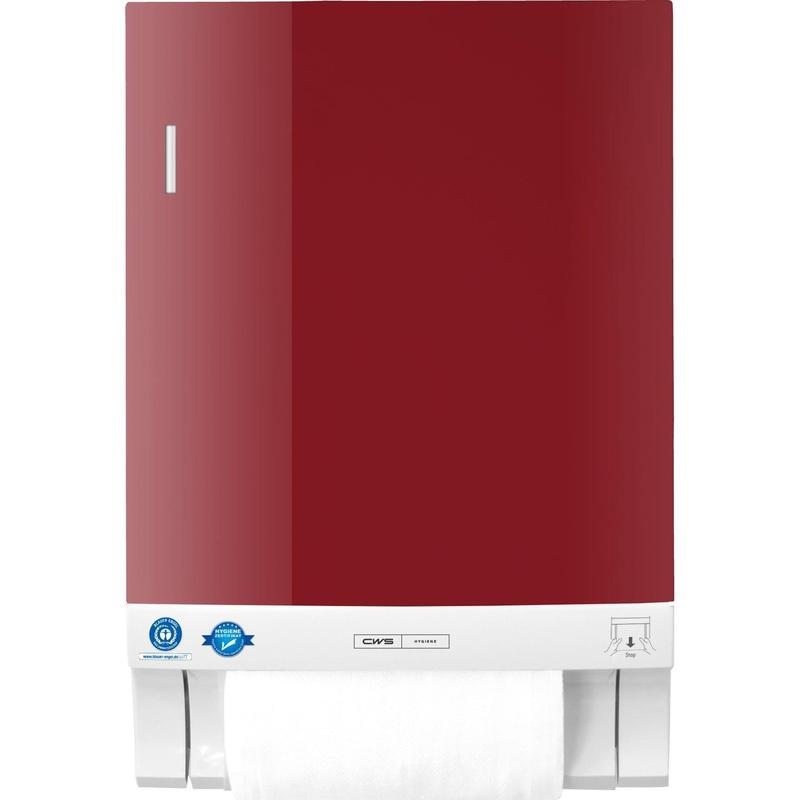 Das CWS Frontpanel für Stoffhandtuchspender Dry Slim ist ein rot-weißes Wandpanel mit einer teilweise freiliegenden Rolle an der Unterseite und einem Zertifizierungsaufkleber in der linken unteren Ecke.