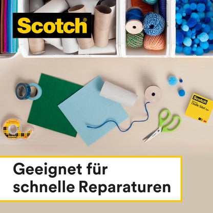 Auf einem Tisch liegen Bastelutensilien - buntes Papier, Scheren, Klebeband, Schnüre, Pappröhren, Pompons - neben einem Scotch® doppelseitigen Klebeband (12 mm x 33 m) der 3M Deutschland GmbH. Das Logo erscheint oben links. Deutscher Text: "Geeignet für schnelle Reparaturen.