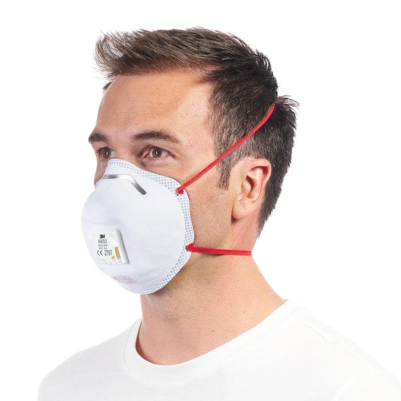 A man in a white shirt is wearing a 3M™ Cool Flow™ Particulate Respirator 8833, FFP3, with valve (from 3M Deutschland GmbH) with red straps, shown in profile against a plain white background.