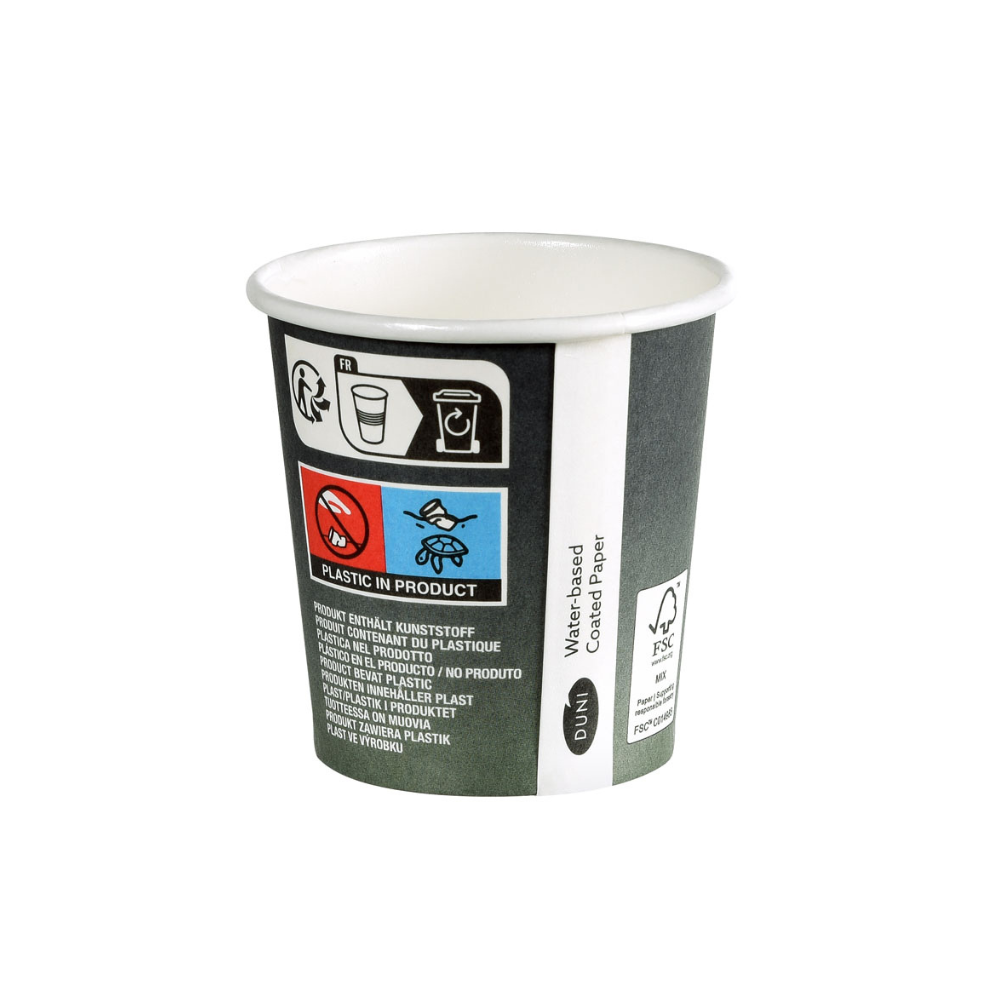 The Duni Urban Coffee Cup PAP/PLA Printed from Duni GmbH is a small disposable cup made of cardboard with symbols and text indicating the plastic content. It features a logo with FSC certification, a skull symbol, and text in various languages emphasizing sustainability for global understanding.