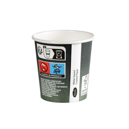 The Duni Urban Coffee Cup PAP/PLA Printed from Duni GmbH is a small disposable cup made of cardboard with symbols and text indicating the plastic content. It features a logo with FSC certification, a skull symbol, and text in various languages emphasizing sustainability for global understanding.